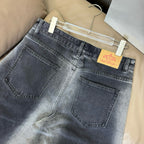Dark blue denim pants with back patch pockets and hanging Prada tag
