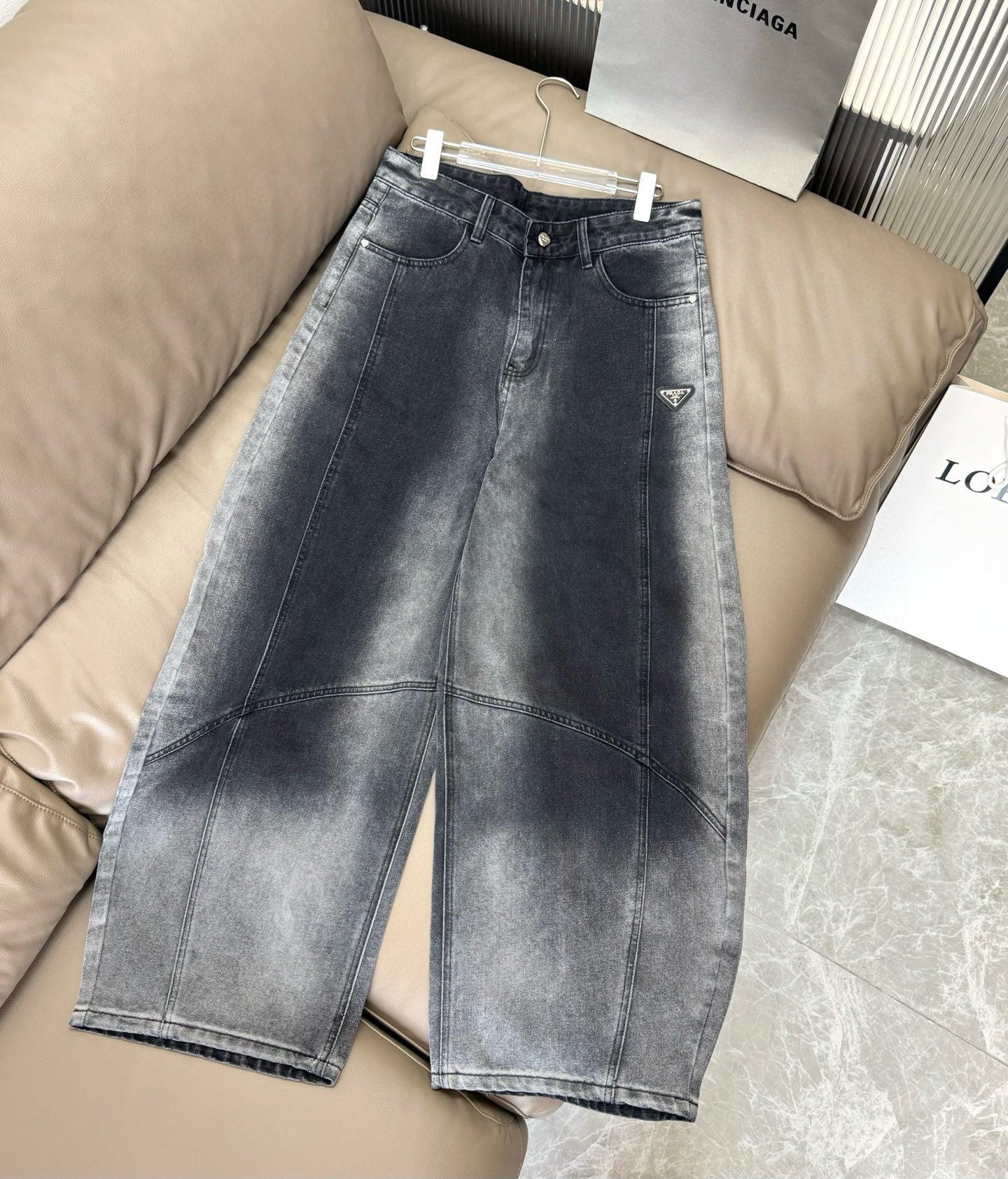 Dark blue denim wide-leg pants with button fly, belt loops, and front pockets