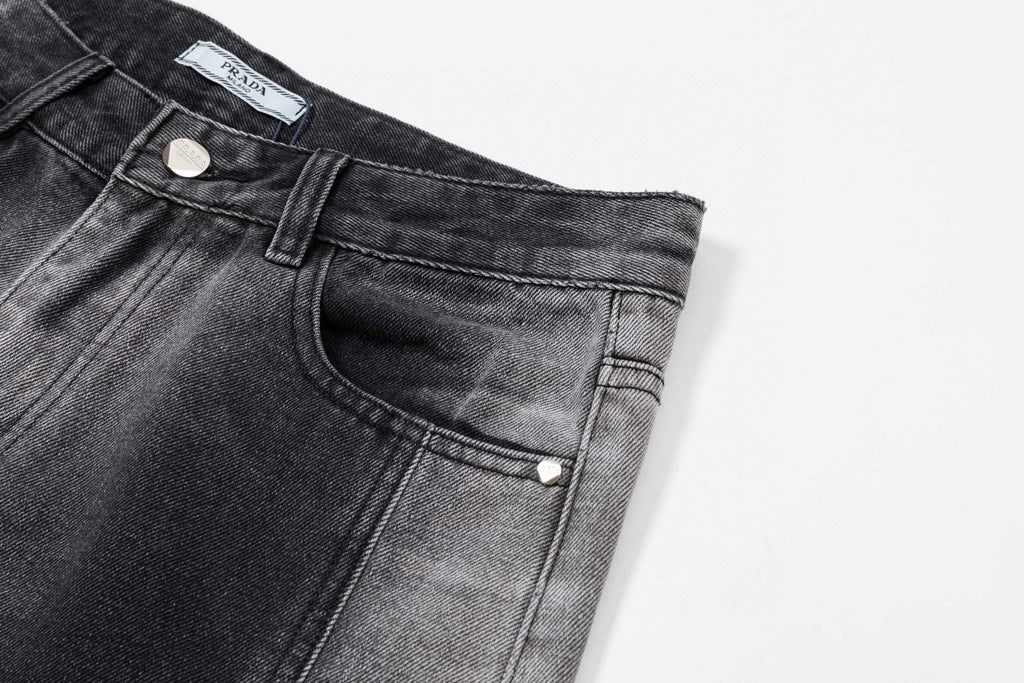 Dark gray denim pants with slanted front pocket and button-fly