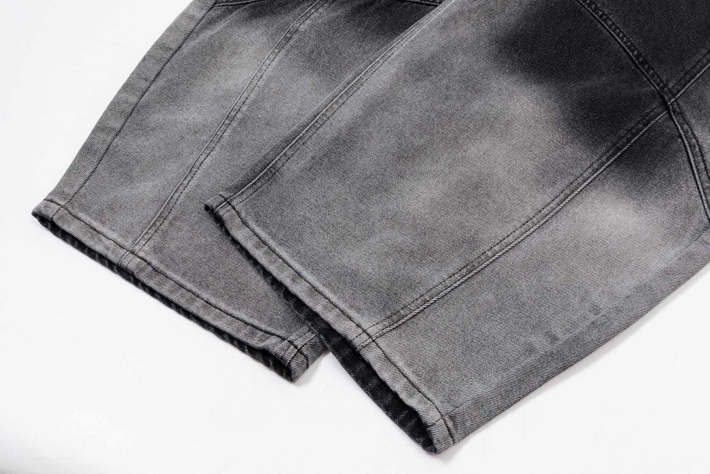 Prada pants in dark gray denim, front fold and stitched seams visible