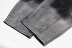 Prada pants in dark gray denim, front fold and stitched seams visible