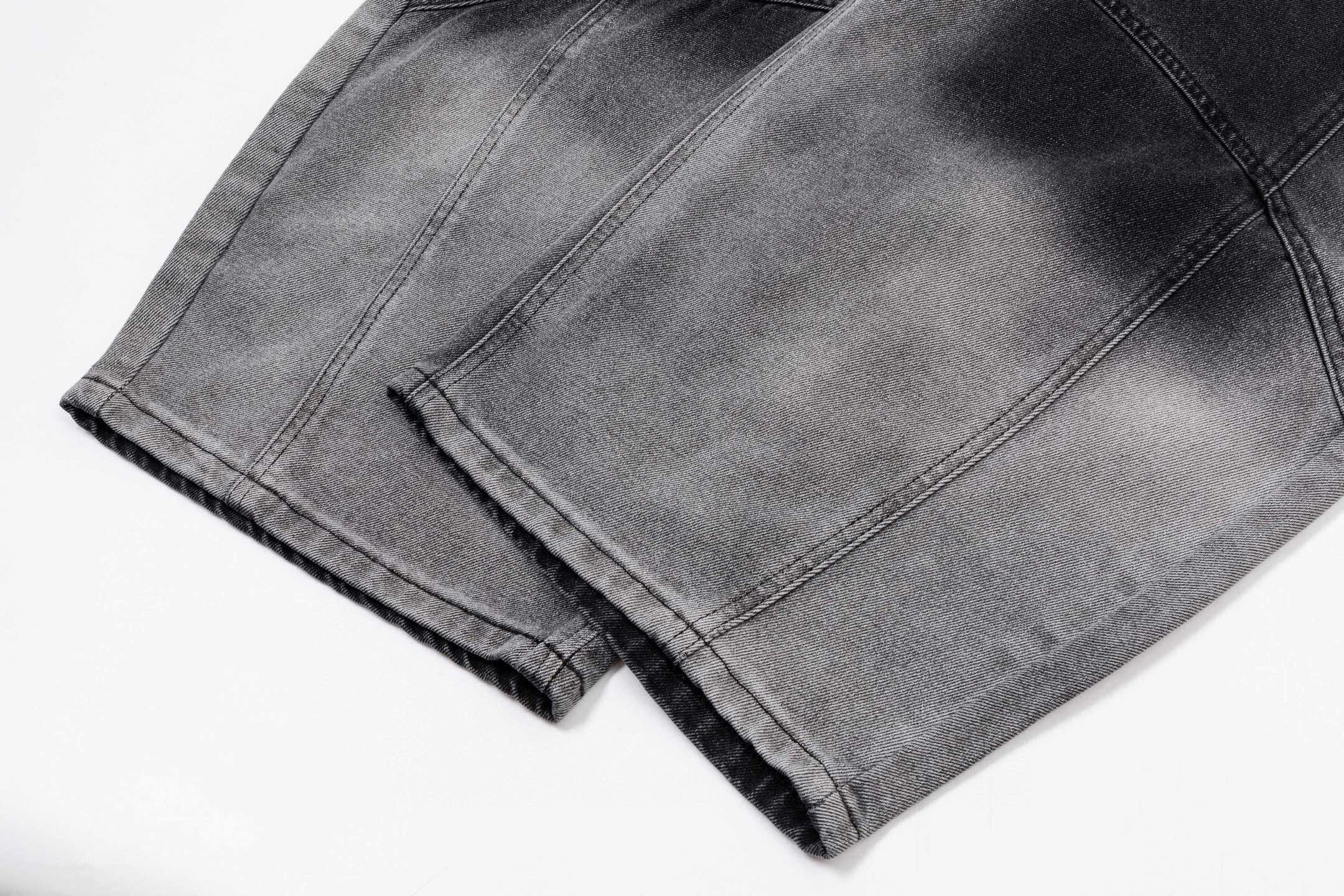 Prada pants in dark gray denim, front fold and stitched seams visible