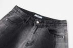 Dark gray denim waistband with button, belt loops, and stitched pockets