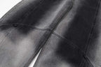 Dark gray denim pants with washed panels and curved side seam