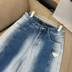 Light blue denim pants with belt loops and front scoop pockets