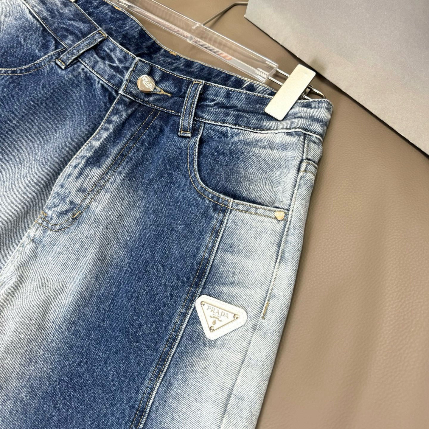 Light blue denim pants with front patch logo on the right pocket
