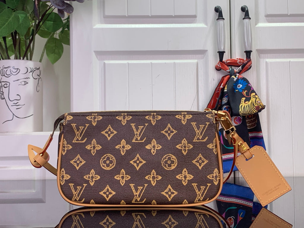 Louis Vuitton monogram shoulder bag with tan leather handles and crossbody strap