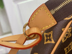 Louis Vuitton tan leather D-ring strap attachment on monogram crossbody bag