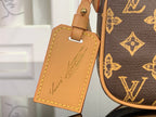 Louis Vuitton monogram bag with tan leather luggage tag and gold loop hardware