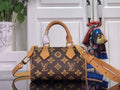 Monogram handbag with tan leather handles and shoulder strap, brown and gold logo pattern.