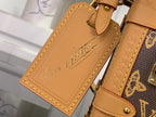 Louis Vuitton tan leather tag with embossed script and yellow edge stitching