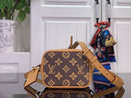 Monogram mini shoulder bag with tan strap and front flap detail