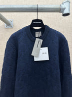 Navy long-sleeve knit sweater with crew neck, hanging Dior tags