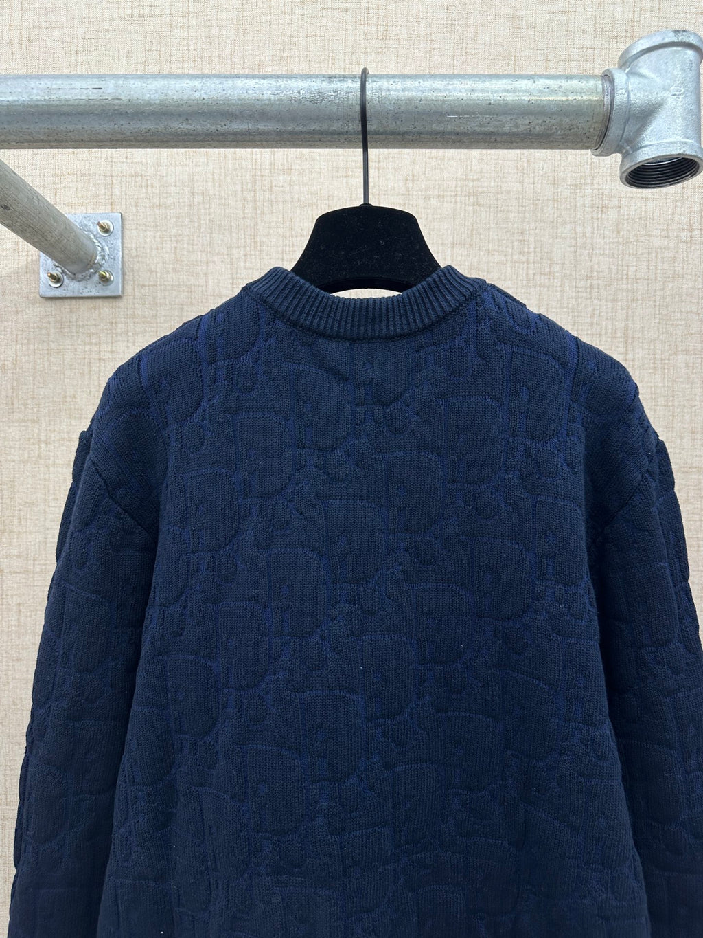 Navy long-sleeve knit sweater with ribbed collar, back view