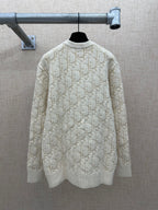 Cream knit sweater back view with allover logo pattern, ribbed crew neck and hem