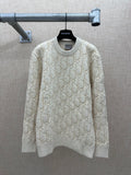 Cream knit sweater with allover logo pattern, ribbed crew neck and cuffs