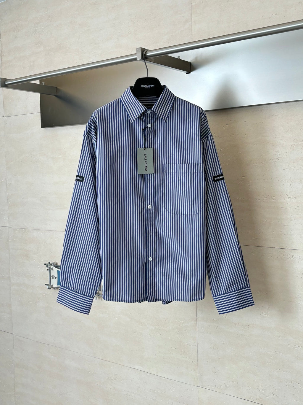 Long-sleeve striped button-up shirt, blue and white vertical stripes, pointed collar