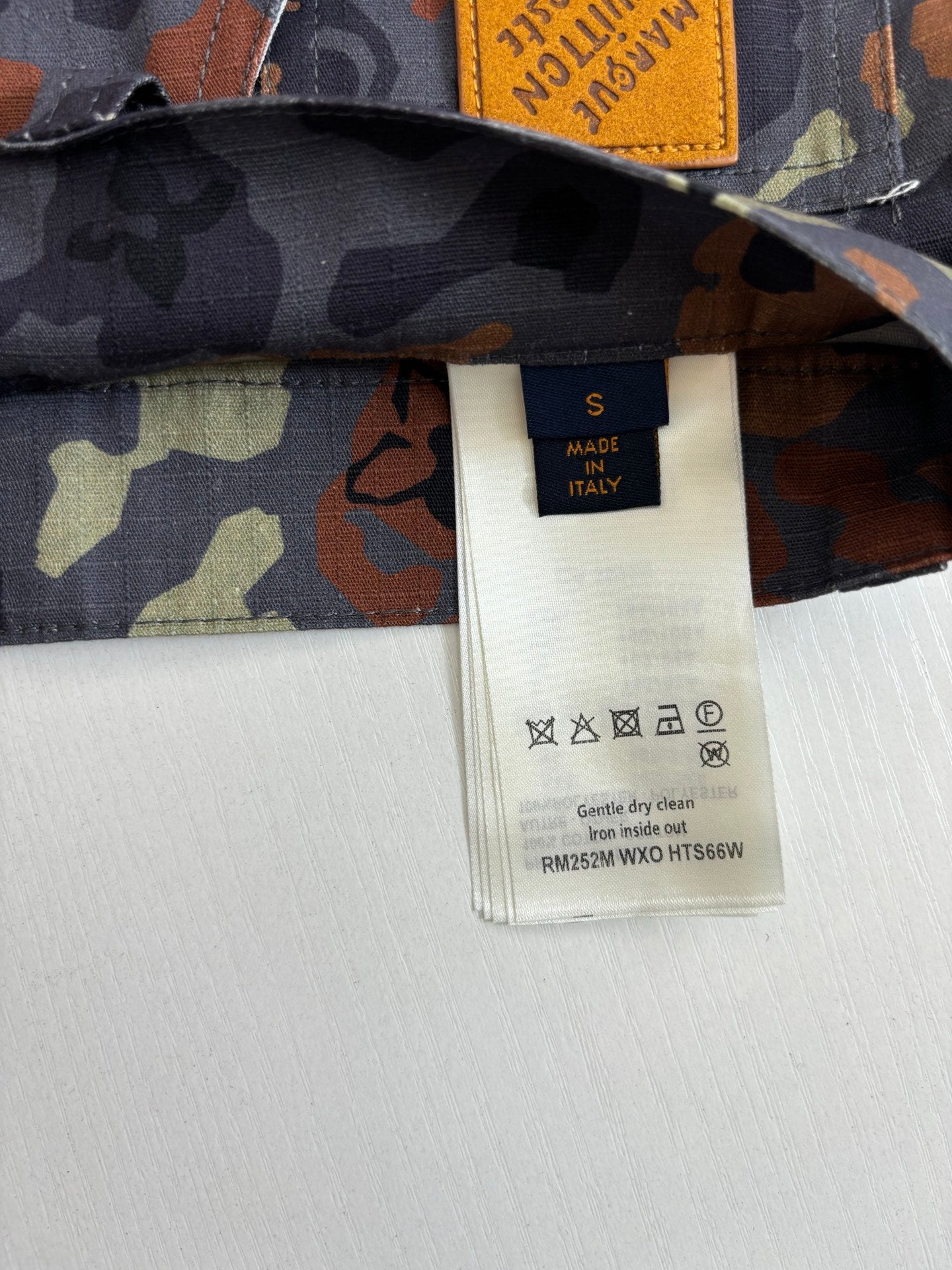 Louis Vuitton pants size S fabric tag on multicolor camo waistband