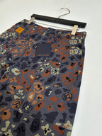 Louis Vuitton patterned shorts on hanger, front logo patch pocket area