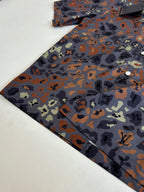 Folded multicolor camo short-sleeve shirt with button-front at right