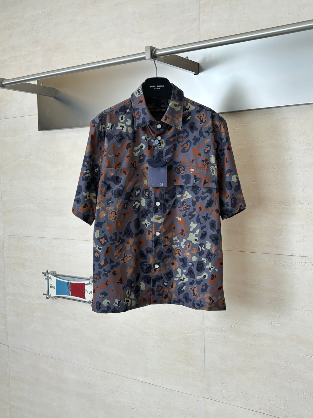Short-sleeve shirt with multicolor camo pattern and partial button placket