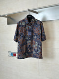 Short-sleeve shirt with multicolor camo pattern and partial button placket