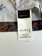 Louis Vuitton shorts interior care label on waistband, light gray with dark print