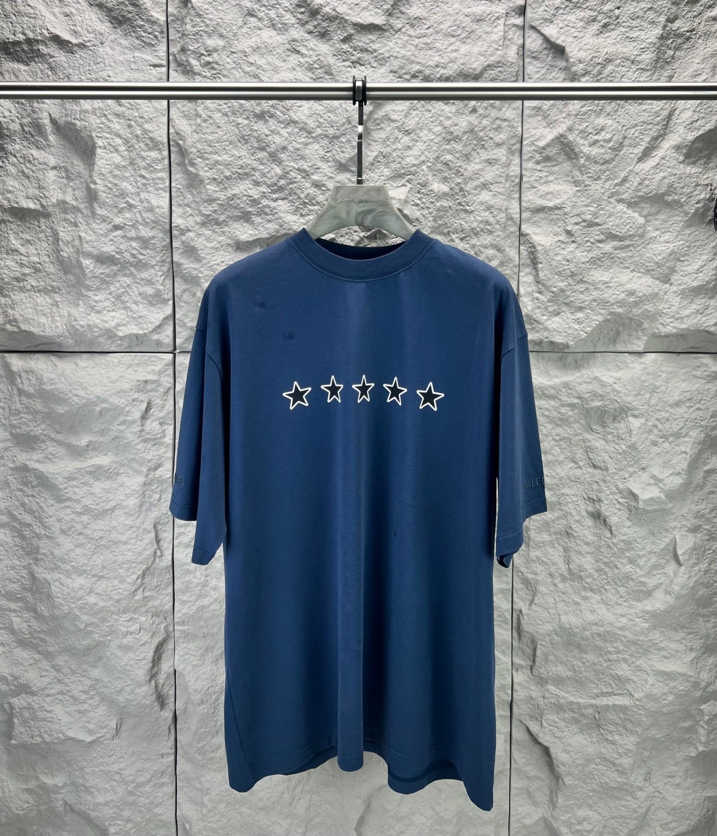 Blue short-sleeve T-shirt with five star print across the chest