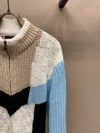 Louis Vuitton knit sweater shoulder detail with cream texture and light-blue sleeve panel