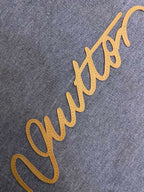 Gray fabric hoodie with yellow embroidered logo script