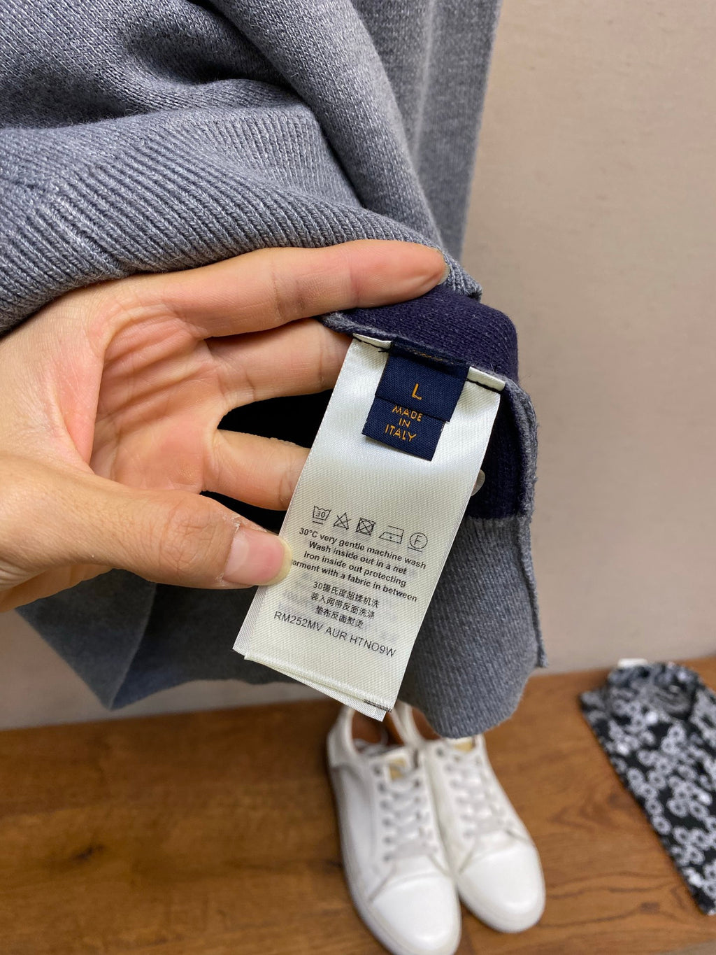 Gray hoodie neckline with brand label tag