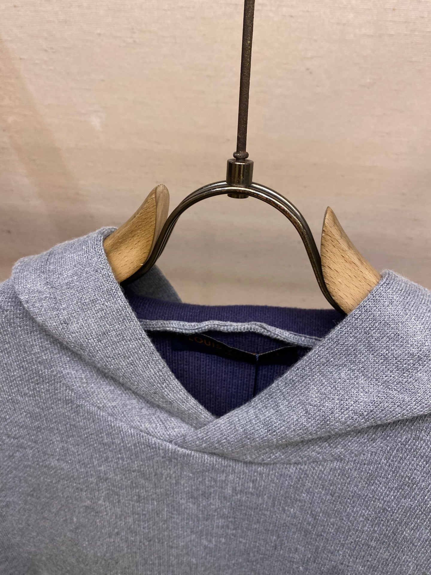 Gray hoodie hood with visible inner navy lining