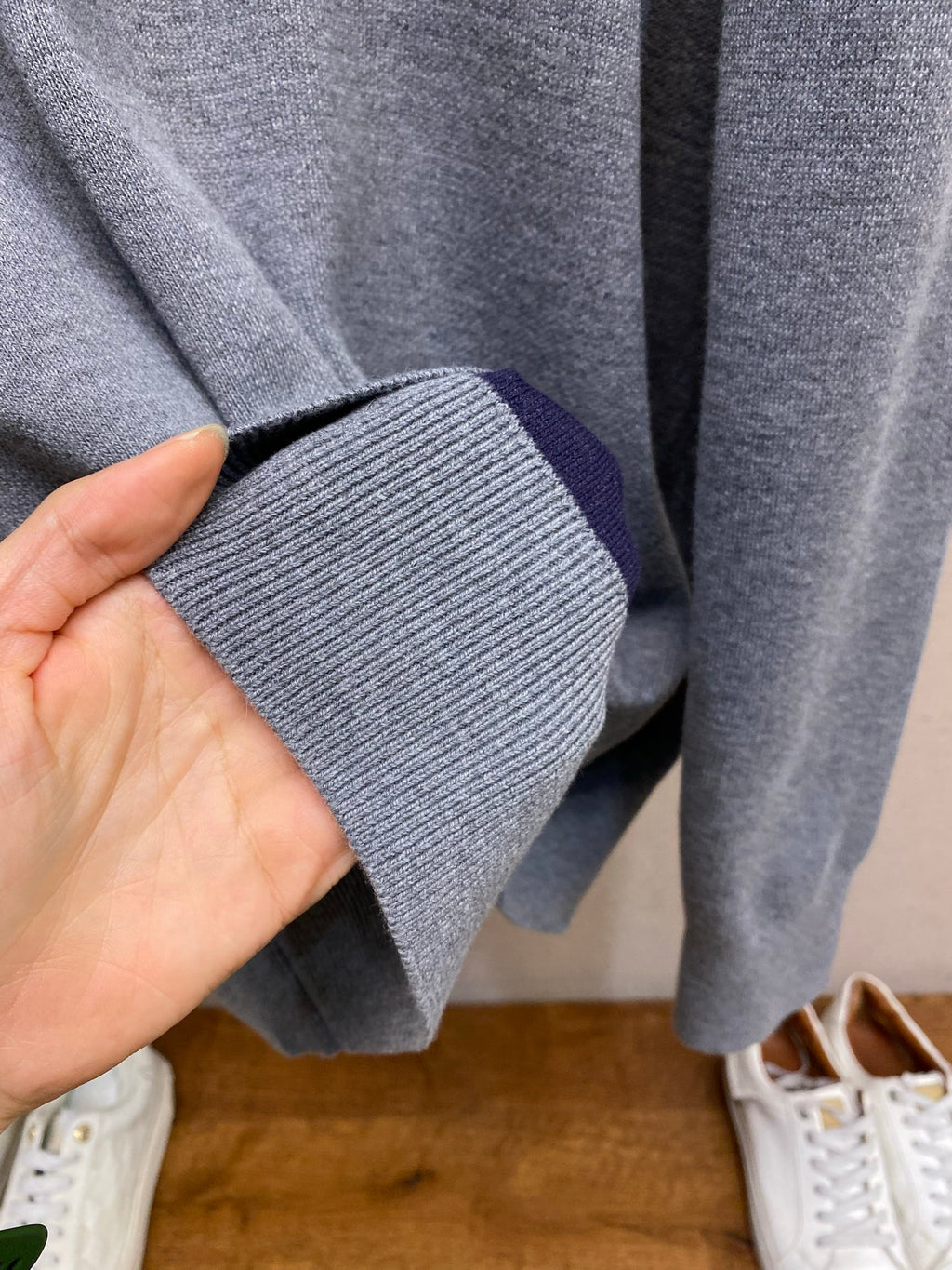 Gray hoodie sleeve cuff and ribbed hem detail