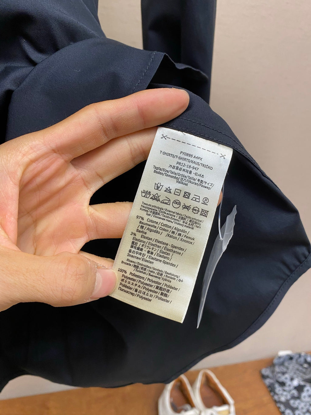 Fendi long-sleeve button-up shirt sleeve with care label tag on inside seam
