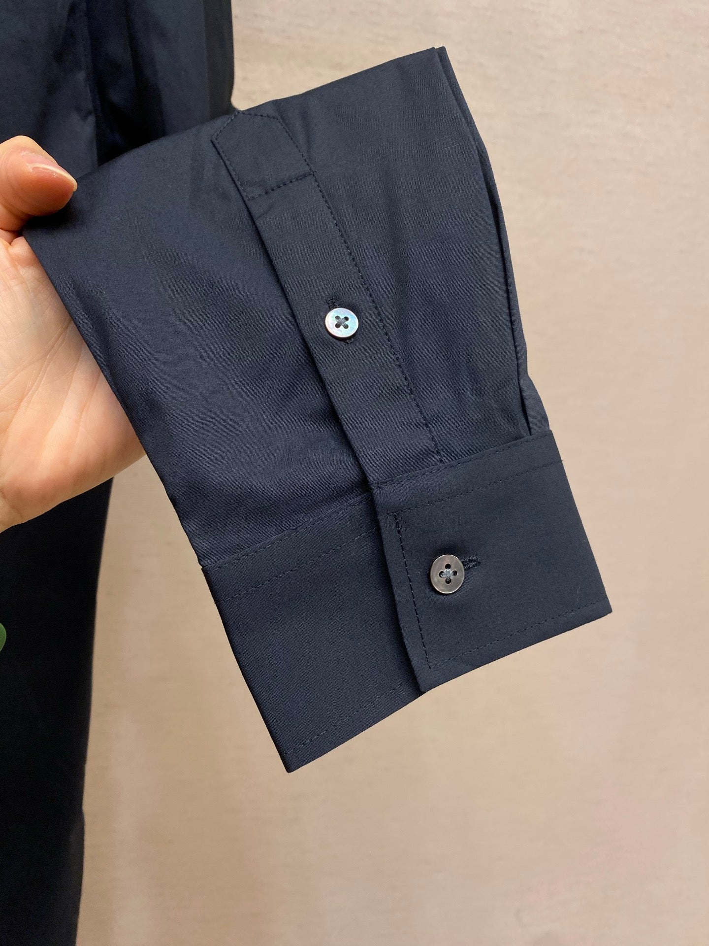 Fendi long-sleeve button-up shirt cuff with two dark navy buttons