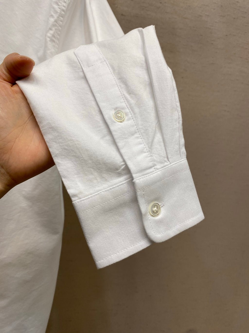 Amiri button-up shirt in white, cuff with button detail and stitching