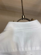 Amiri button-up shirt in white, high collar and neckline seam close-up