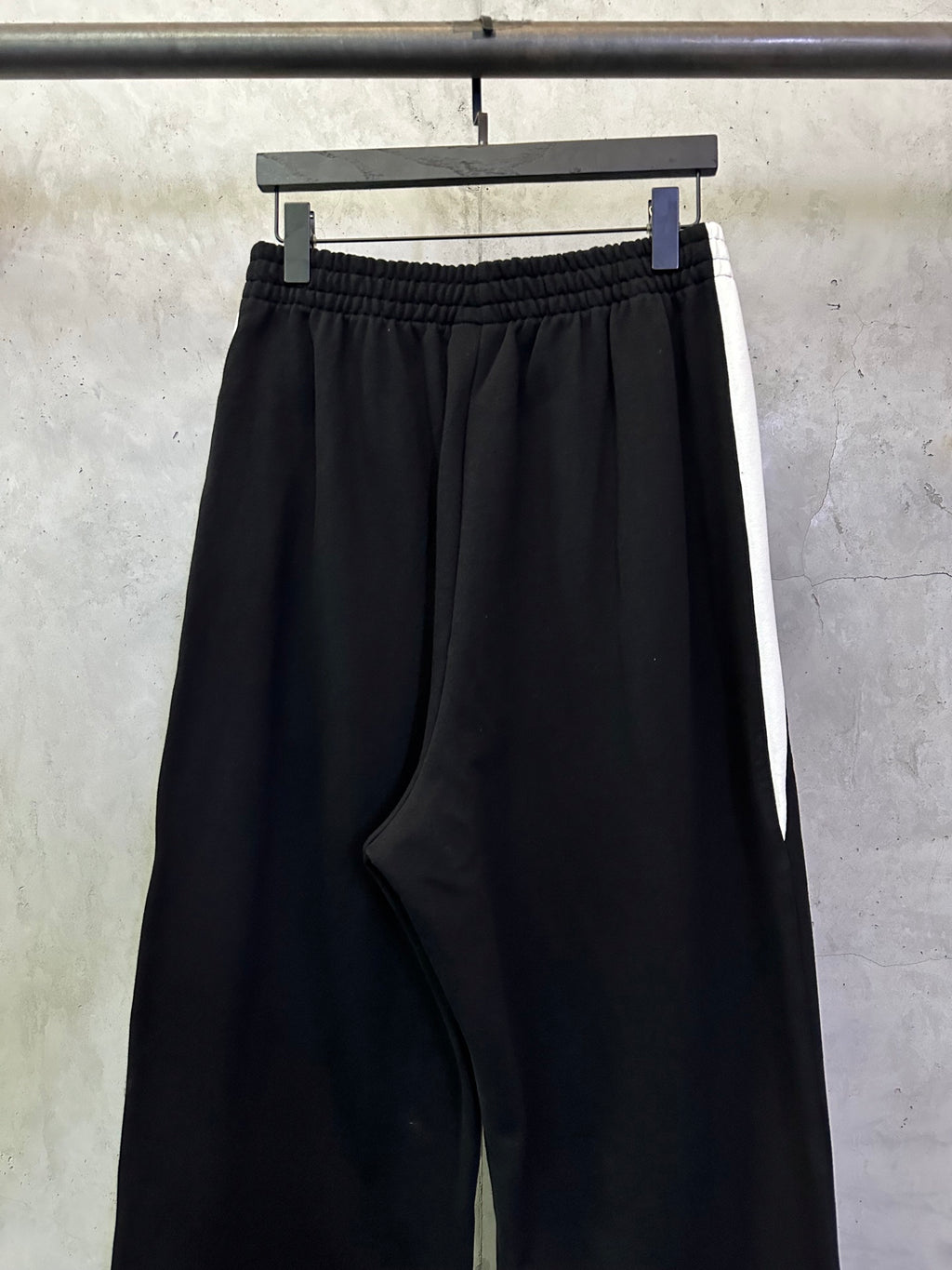 Black Balenciaga pants with front NBA logo and small side detail