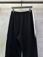 Black Balenciaga pants with front NBA logo and small side detail