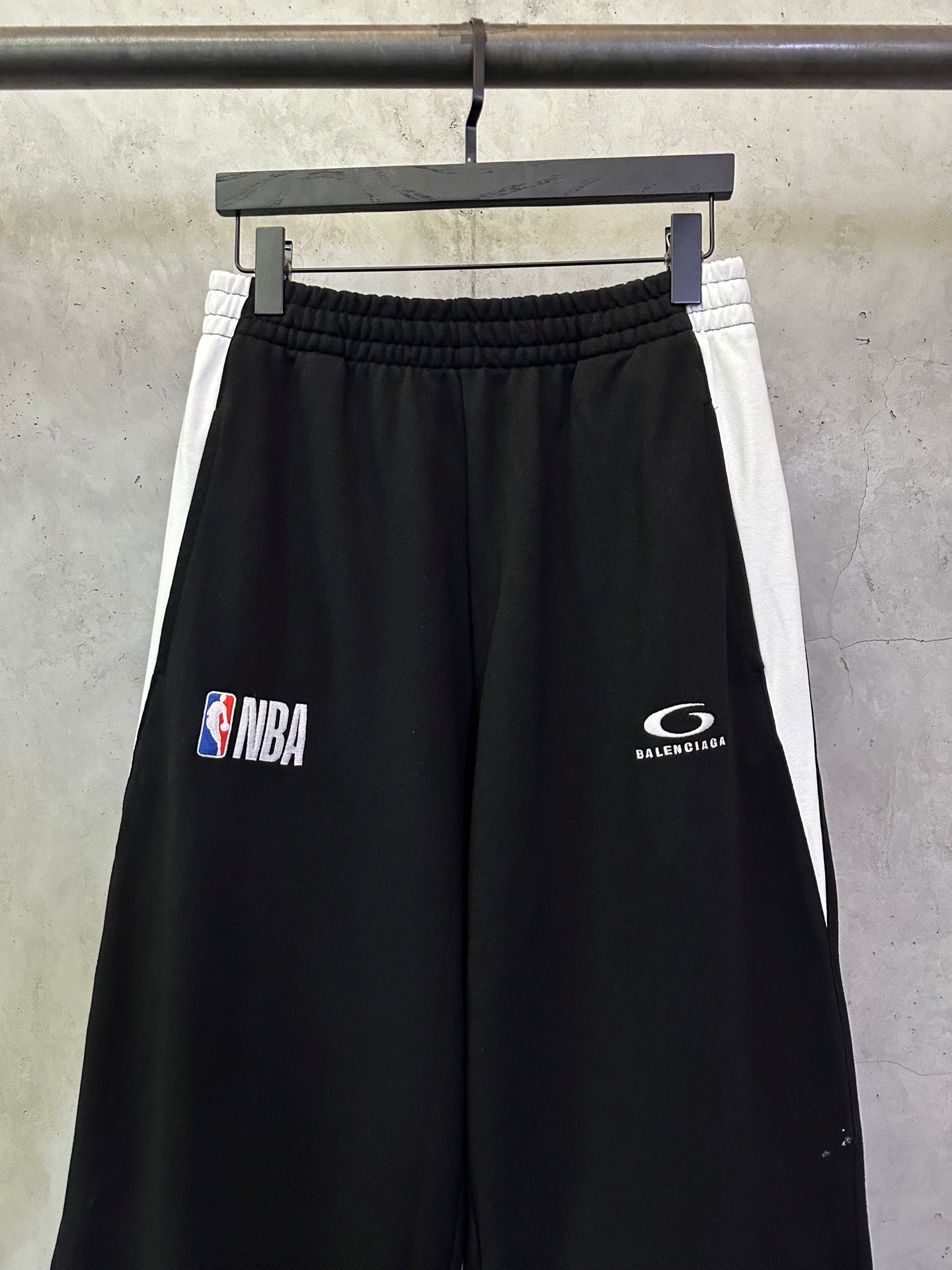 Black Balenciaga pants with NBA and Balenciaga logo prints on front
