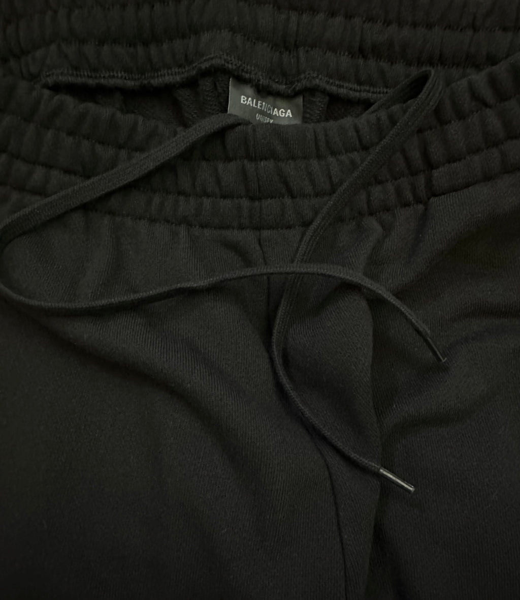 Black elastic-waist pants with Balenciaga inner label and drawstring