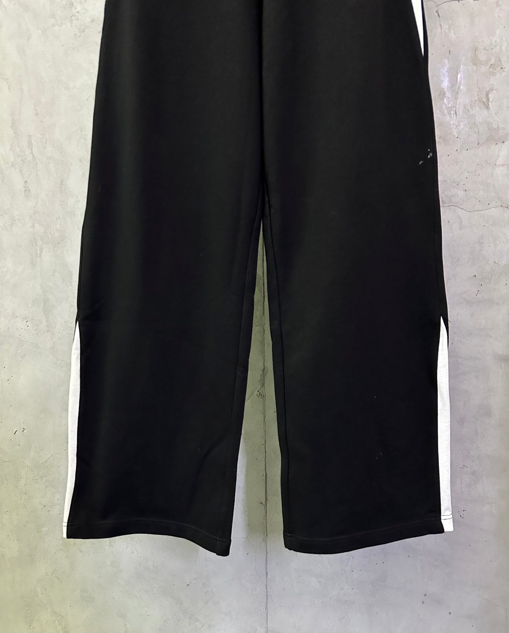 Black Balenciaga wide-leg pants with elastic waistband and straight seam