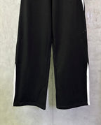 Black wide-leg pants with elastic waistband and straight, relaxed legs