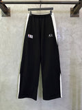 Black wide-leg pants with elastic waistband and NBA and Balenciaga logos
