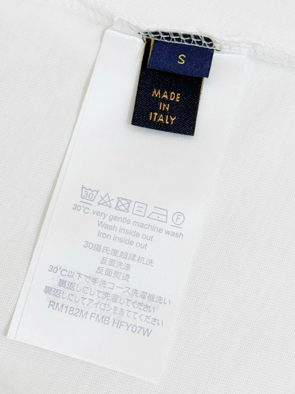 White Louis Vuitton T-shirt care label showing size S and Made in Italy
