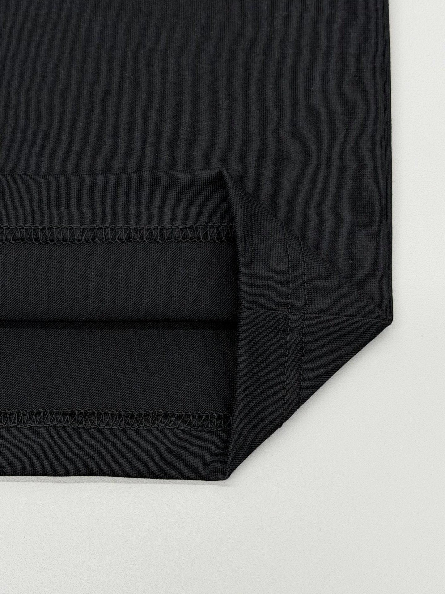 Black Prada T-shirt with stitched hem and side seam detail
