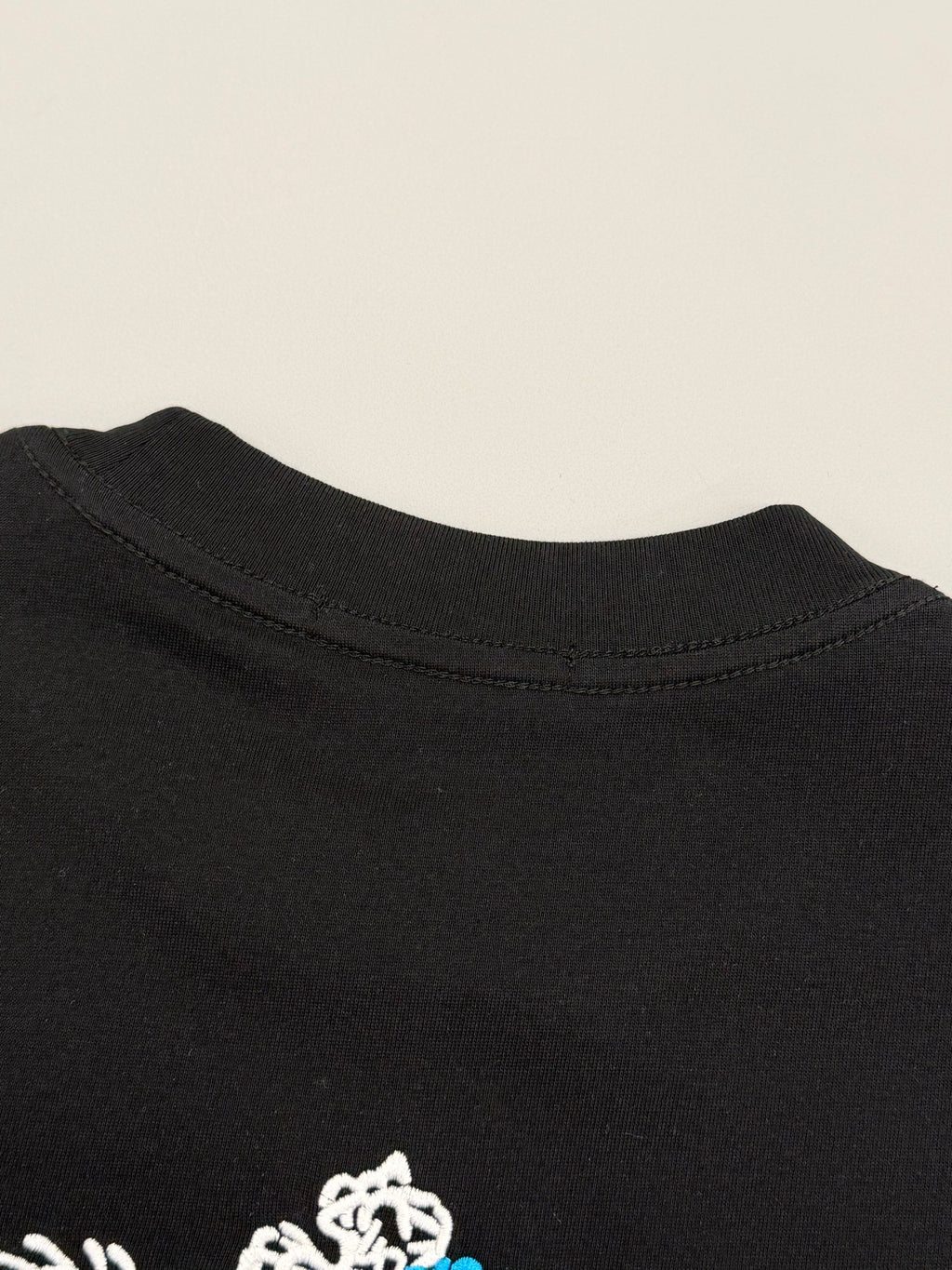 Black Prada T-shirt back collar with small white emblem detail