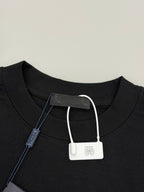 Black Prada T-shirt neckline with white drawstring-style tag and inner label