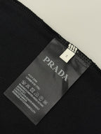 Black Prada T-shirt fabric tag with size and care instructions