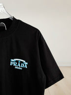 Prada Milano black short-sleeve T-shirt with small blue logo on sleeve
